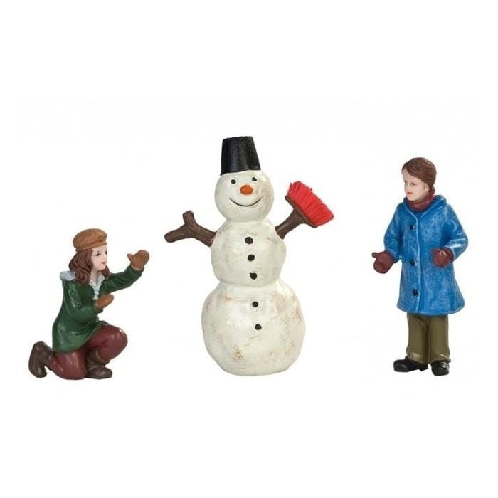 Dickensville Kinderen maken sneeuwpop